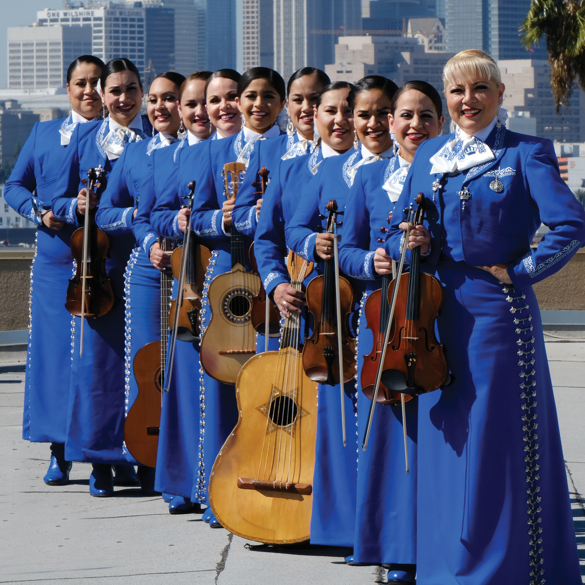 11 artists in blue charro outfits holding instruments.